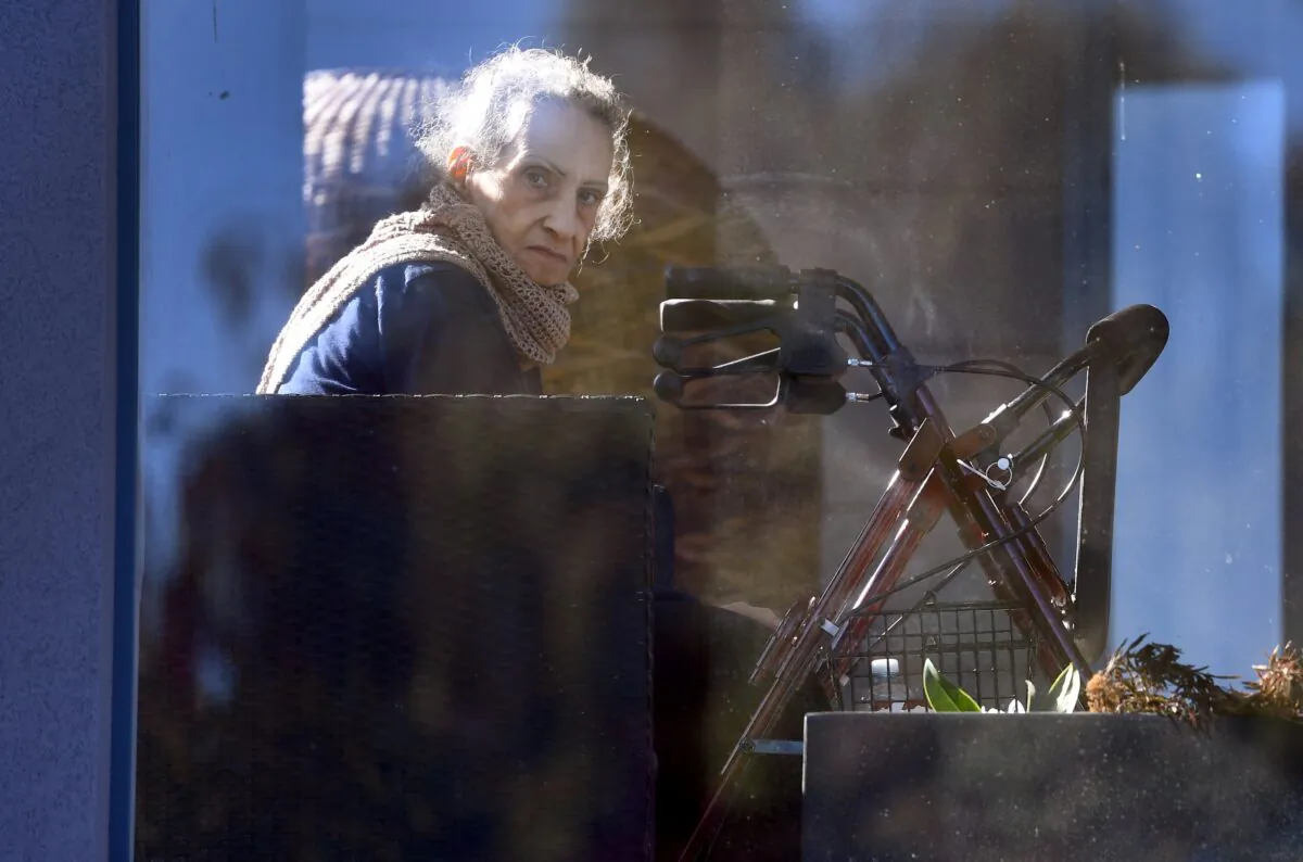 A resident looks from an aged care facility in Melbourne, Australia on May 31, 2021.(William West/AFP via Getty Images)
