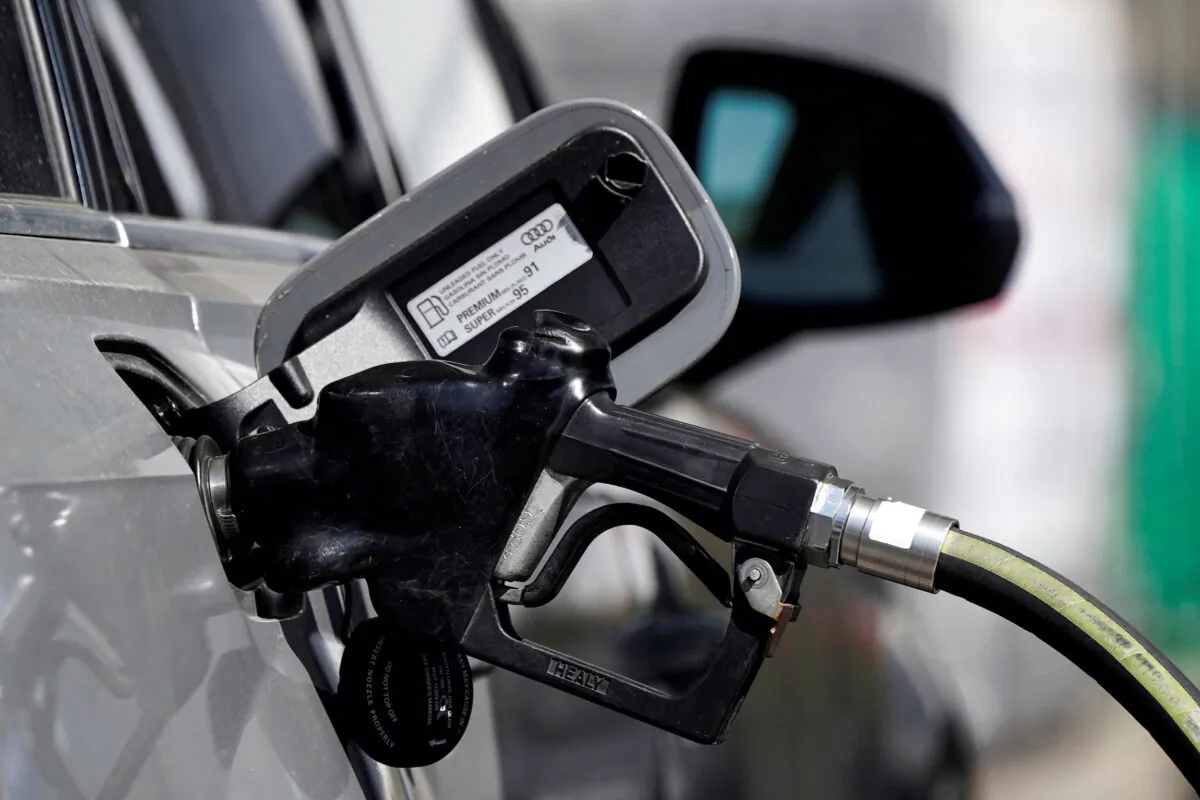 Filling a car at a gas station in West Hollywood, Calif., on March 10, 2022. (Bing Guan/Reuters)