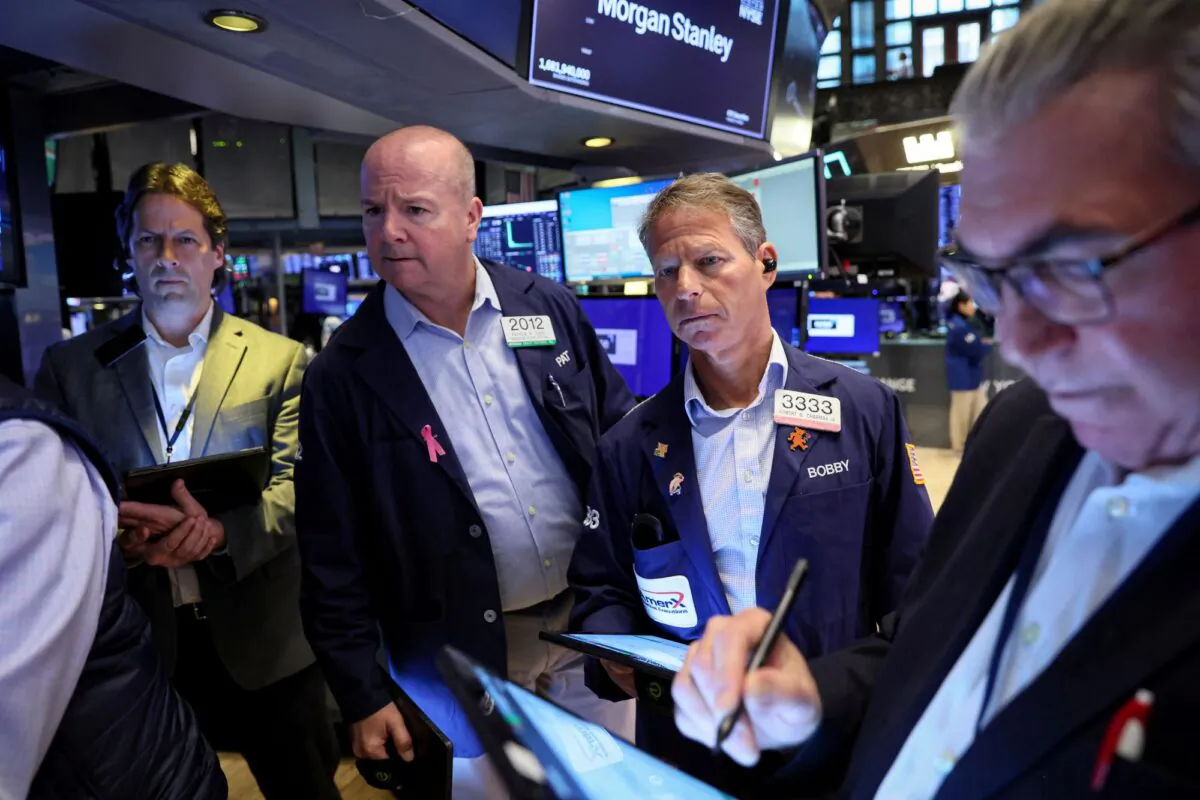 Traders work on the floor of the New York Stock Exchange (NYSE) in New York City on April 19, 2023. (Brendan McDermid/Reuters)