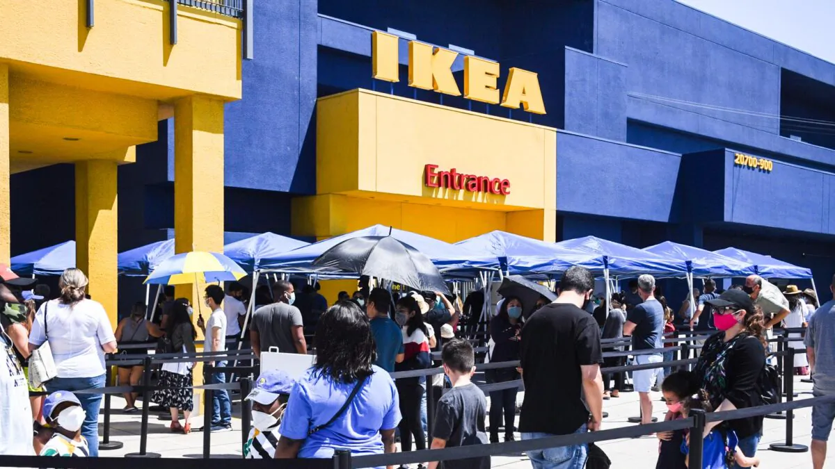 People wait in line to shop at Ikea in Carson, Calif., on July 4, 2020. (Robyn Beck/AFP via Getty Images)