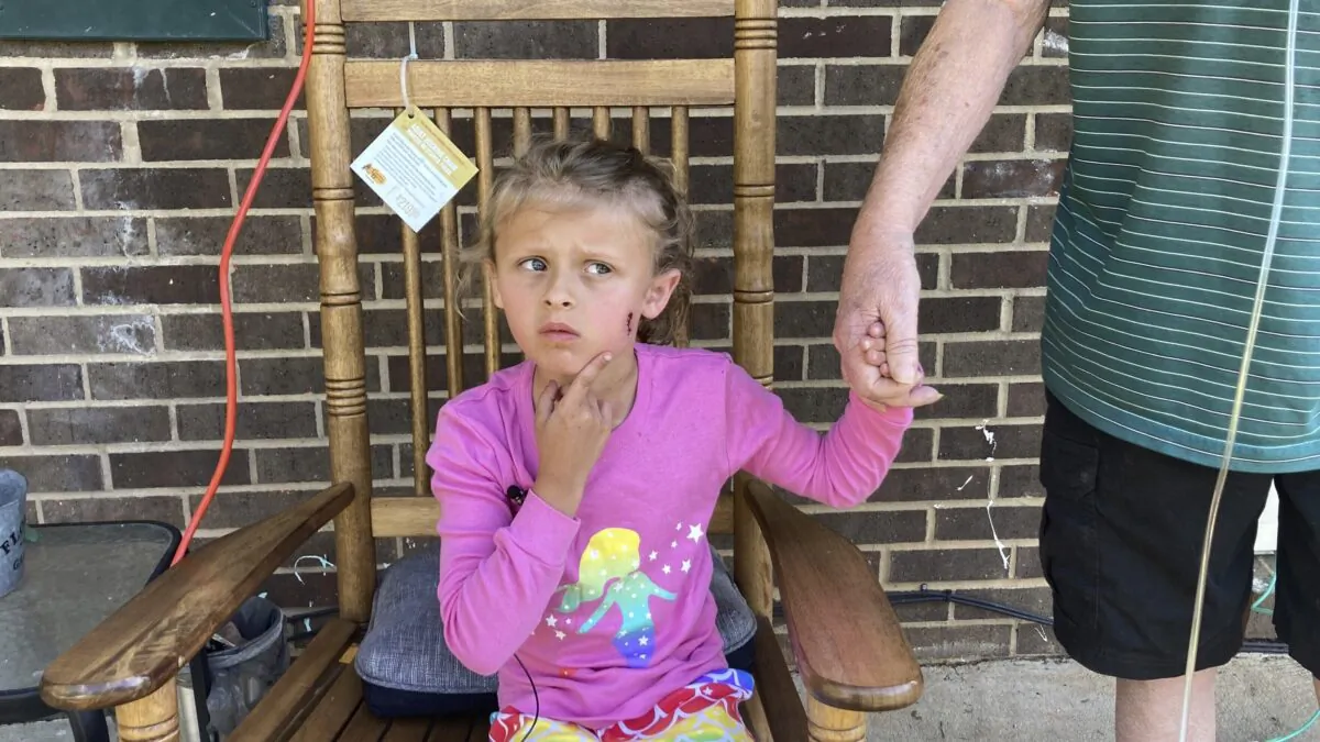 Kinsley White, 6, shows reporters a wound left on her face, in Gastonia, N.C., on April 20, 2023. (Kara Fohner/The Gaston Gazette via AP)