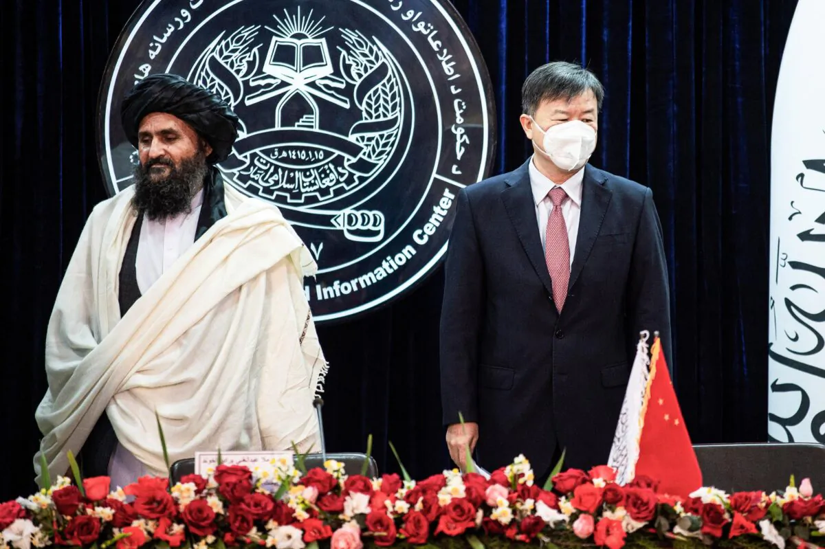Afghanistan's acting first deputy prime minister Abdul Ghani Baradar (L) and China's ambassador to Afghanistan Wang Yu in Kabul on Jan. 5, 2023. (Ahmad Sahel Arman/AFP via Getty Images)
