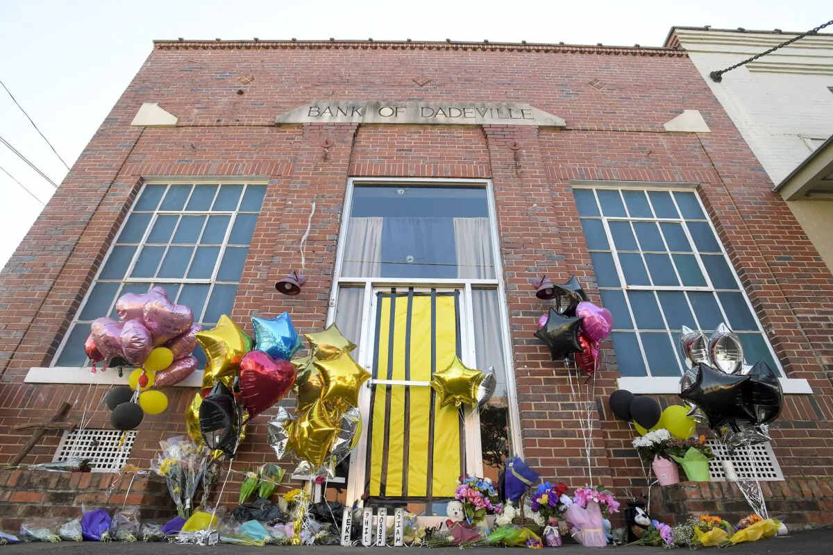 A makeshift memorial is created at the scene of the fatal shooting at a dance studio in Dadeville, Ala., on April 19, 2023. (Mickey Welsh/The Montgomery Advertiser via AP)