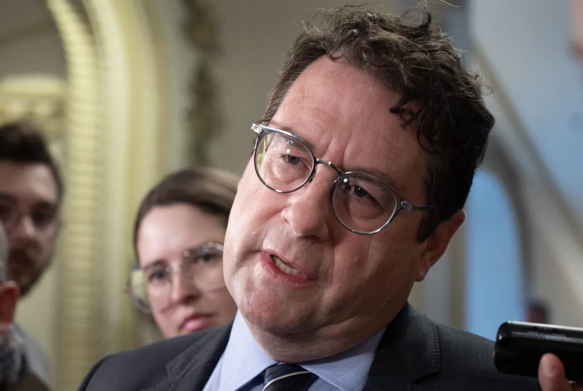 Quebec Education Minister Bernard Drainville responds to reporters' questions at the legislature in Quebec City on April 20, 2023. (Jacques Boissinot/The Canadian Press)