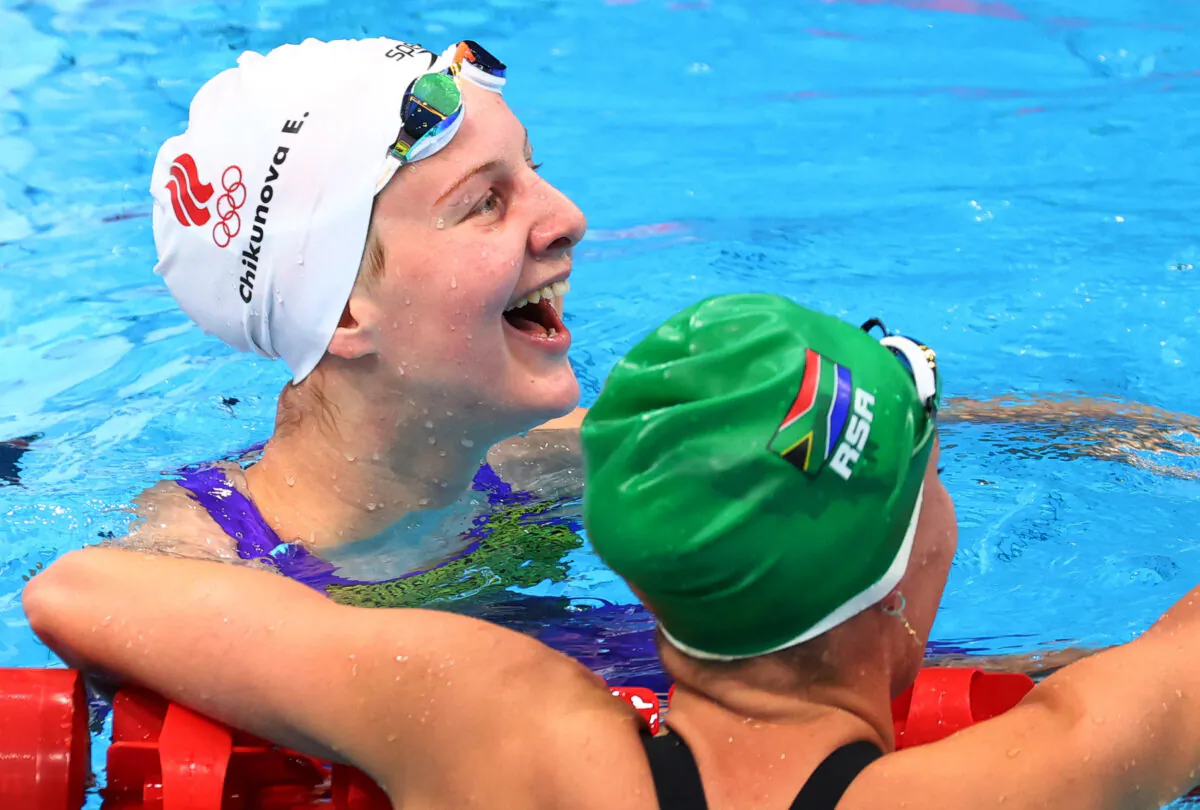Evgeniia Chikunova of the Russian Olympic Committee and Tatjana Schoenmaker of South Africa react react after a semifinal of the women's 200m breaststroke swimming event during the Tokyo 2020 Olympic Games at the Tokyo Aquatics Centre in Tokyo on July 29, 2021. (Lisi Niesner/Reuters)