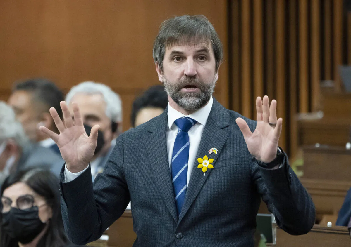 Minister of Environment and Climate Change Steven Guilbeault rises during Question Period, Monday, April 4, 2022 in Ottawa.  THE CANADIAN PRESS/Adrian Wyld