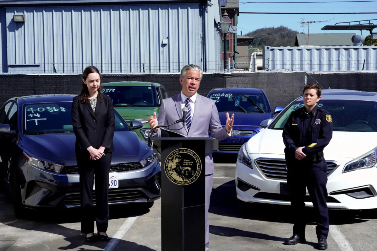California Attorney General Rob Bonta, (C), flanked by Deputy Attorney General Holly Mariella, (L), and Berkeley Police Chief Jennifer Louis, (R), speaks during a news conference about the surge in thefts of KIA and Hyundai vehicles, in Berkeley, Calif., on April 20, 2023. (Terry Chea/AP Photo)