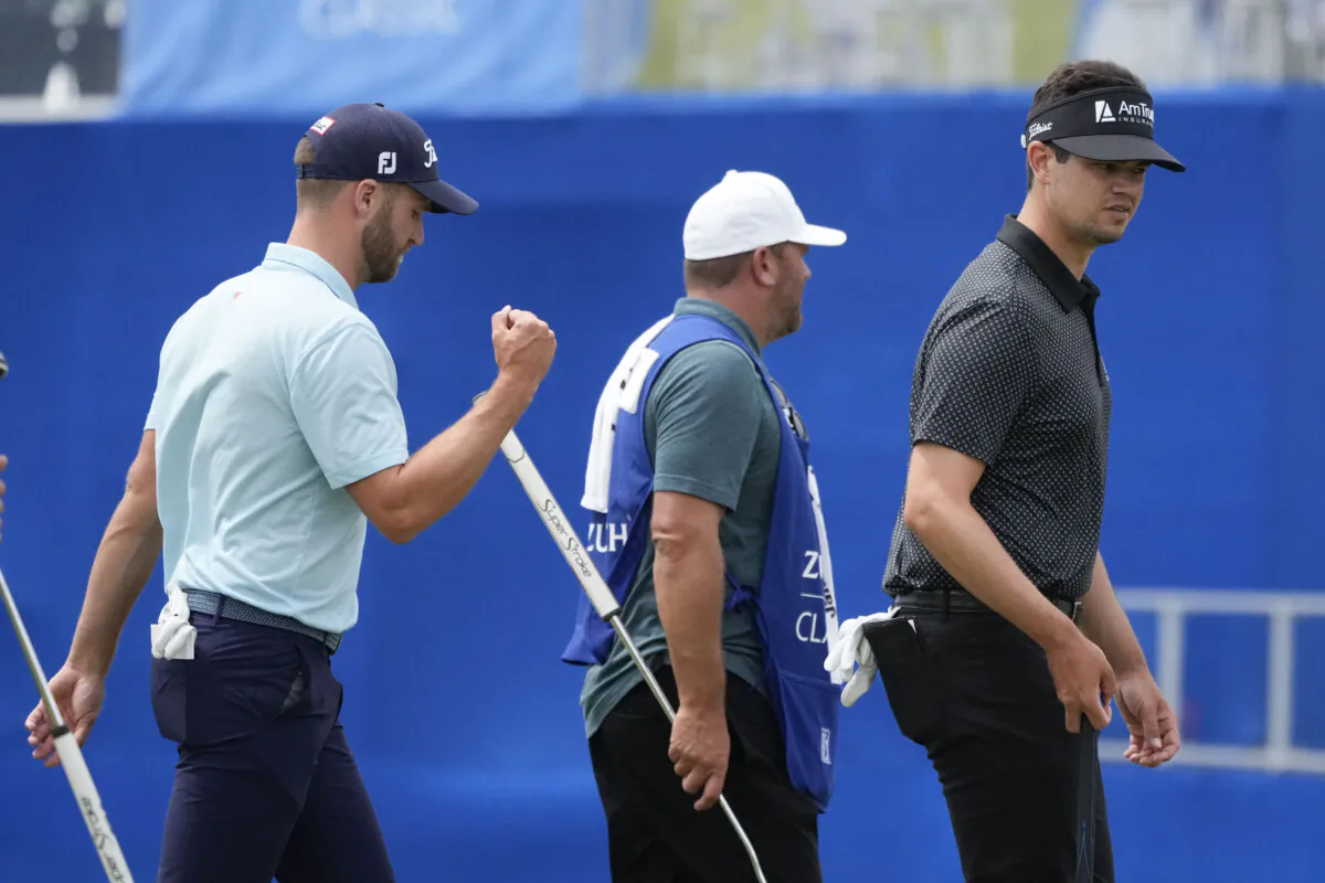 Wyndham Clark, left, and his teammate Beau Hossler, right, walk off the 9th green after finishing for the day during the second round of the PGA Zurich Classic golf tournament at TPC Louisiana in Avondale, La., on April 21, 2023. (Gerald Herbert/AP Photo)