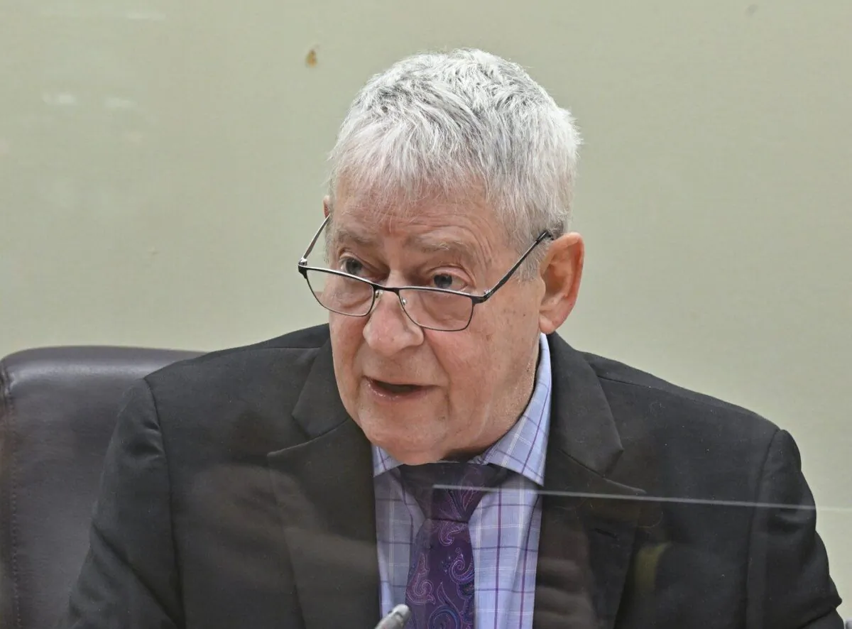 Quebec coroner Luc Malouin speaks at the beginning of a coroner’s inquest in Quebec City, Feb. 13, 2023. (The Canadian Press/Jacques Boissinot)