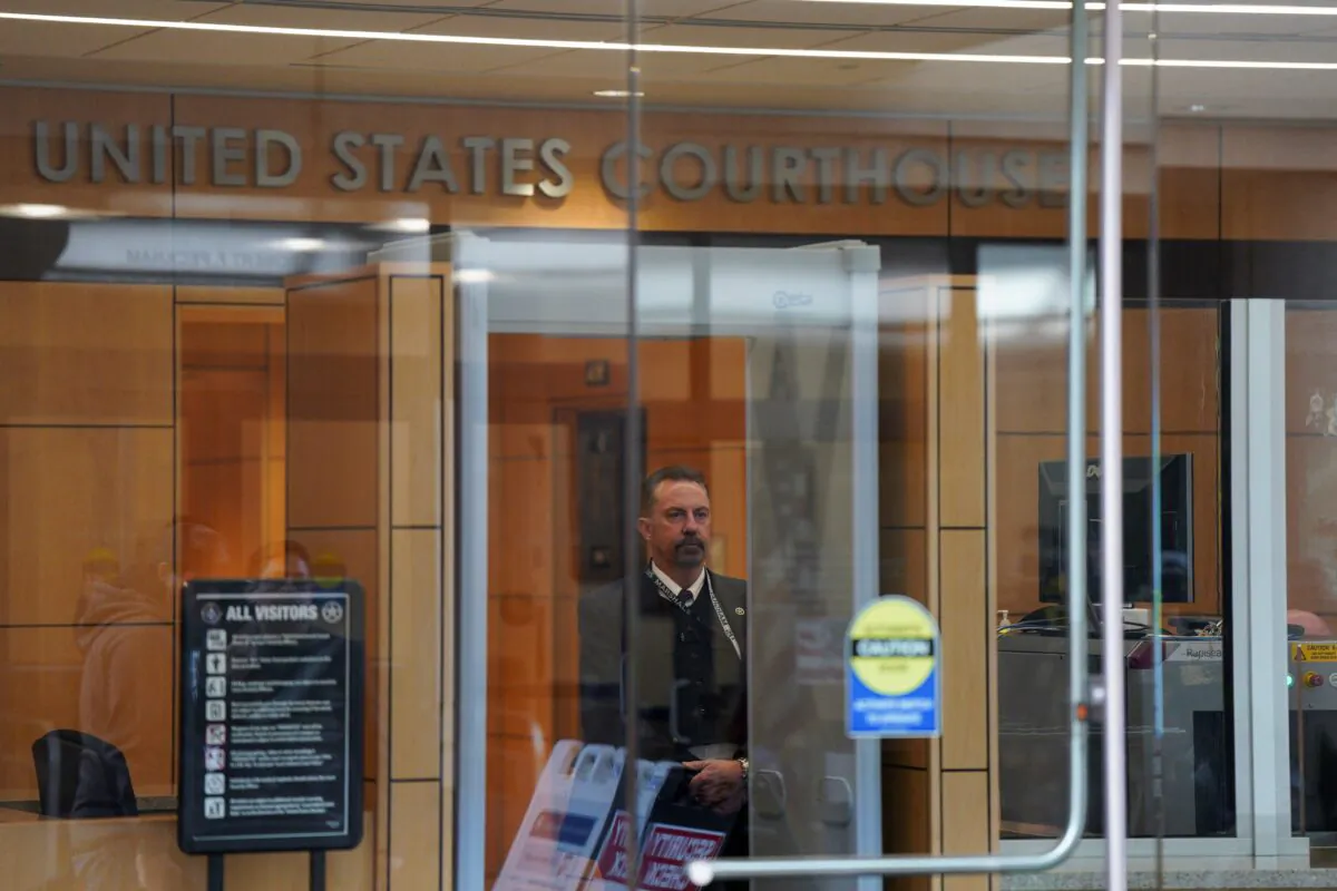 A security staff member stands inside Robert F. Peckham Federal Building and U.S. Courthouse on the day Peru's former President Alejandro Toledo, wanted in his home country on charges of taking millions of dollars in bribes, is expected to turn himself in for extradition, in San Jose, Calif., on April 21, 2023. (Loren Elliott/Reuters)