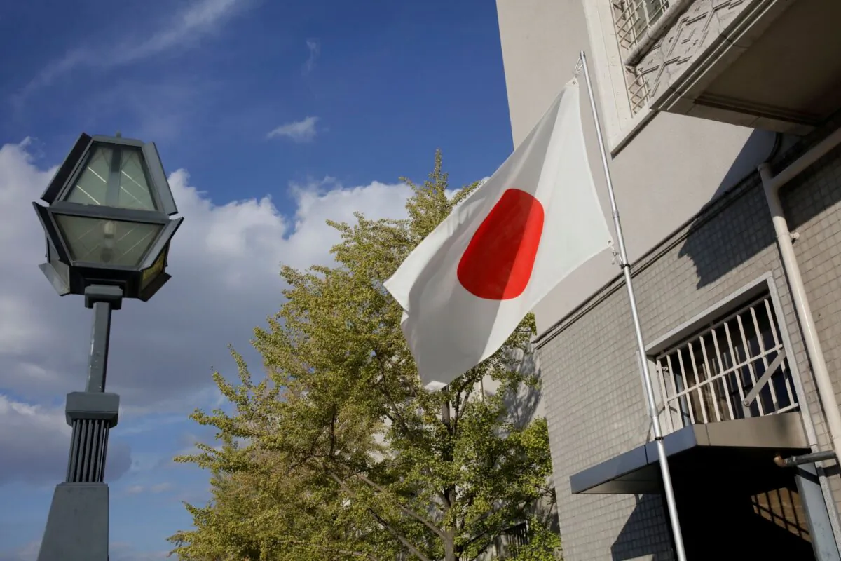 The Japanese flag flies in a park in Osaka, Japan, on Oct. 30, 2018. (Thomas White/Reuters)