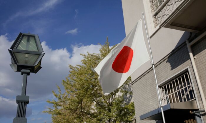 The Japanese flag flies in a park in Osaka, Japan, on Oct. 30, 2018. (Thomas White/Reuters)