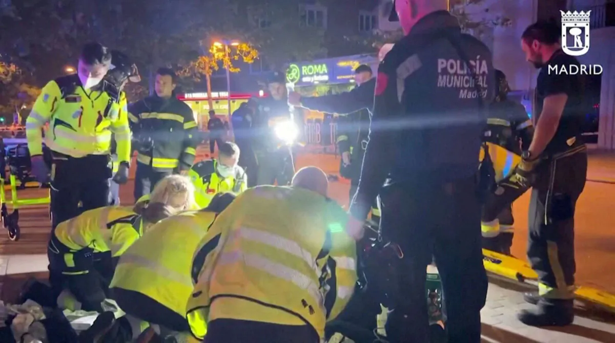 Rescuers work outside a restaurant following a fire in Madrid on April 21, 2023, in this screen grab taken from a handout video. (Madrid Emergency Service/Handout via Reuters)