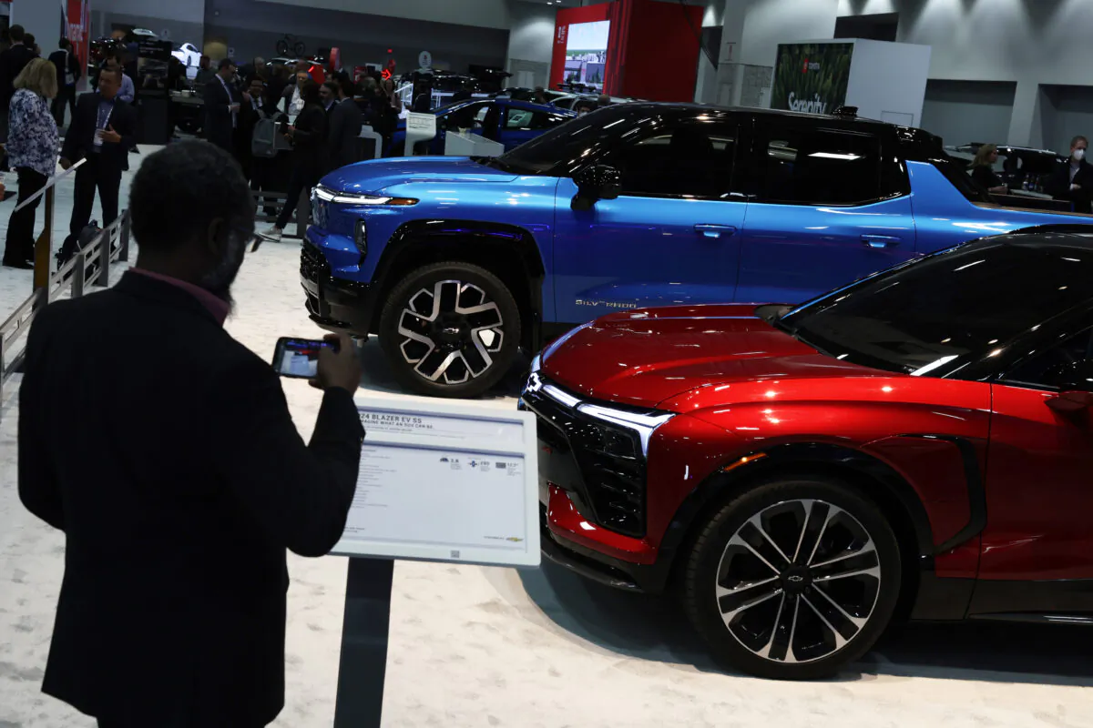 An all-electric Chevrolet Silverado and a 2024 Chevrolet Blazer EV are on display during a preview at the Washington, D.C. Auto Show at Walter E. Washington Convention Center, in Washington, on Jan. 19, 2023. (Alex Wong/Getty Images)