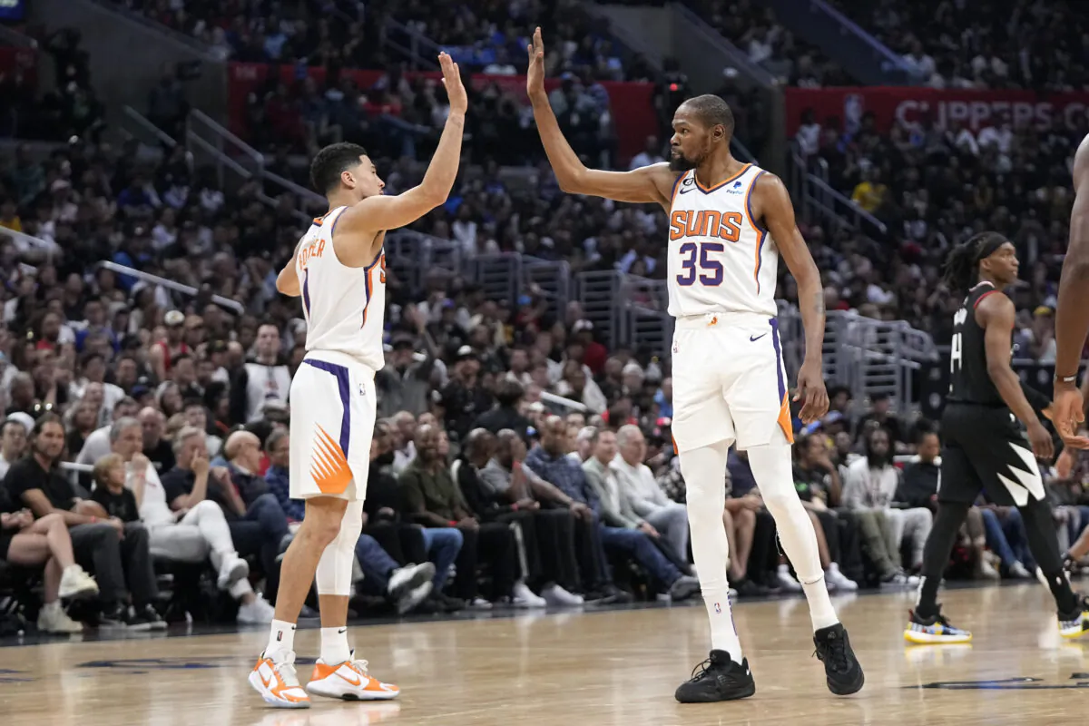 Phoenix Suns guard Devin Booker, left, and forward Kevin Durant congratulate each other during the second half in Game 4 of a first-round NBA basketball playoff series against the Los Angeles Clippers in Los Angeles on April 22, 2023. (Mark J. Terrill/AP Photo)