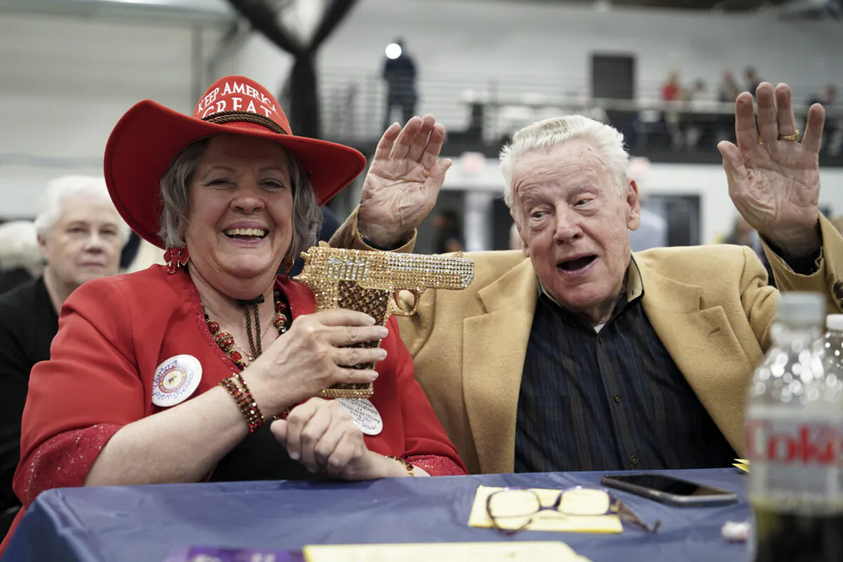 Two Iowa Faith & Freedom Coalition guests pose for a photo in Clive, Iowa, on April 22, 2023. (Madalina Vasiliu/The Epoch Times)