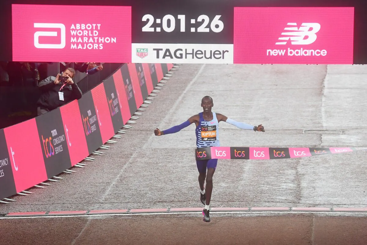 Kelvin Kiptum of Kenya crosses the finish line to win the Elite Men's Marathon during the 2023 TCS London Marathon in London on April 23, 2023. (Alex Davidson/Getty Images)