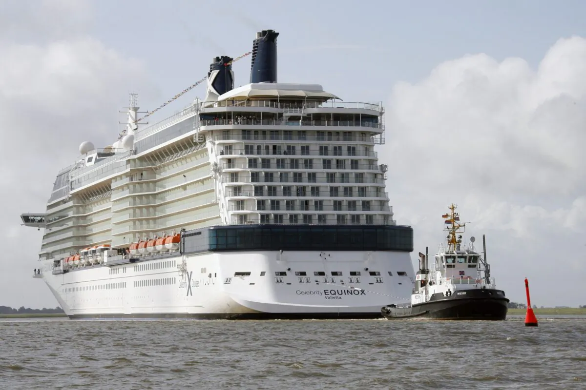 The cruiser Celebrity Equinox built by the shipyard Meyer in Papenburg, Germany, goes down the river Ems near Gandersum, Germany, on June 20, 2009. (Joerg Sarbach/AP Photo)