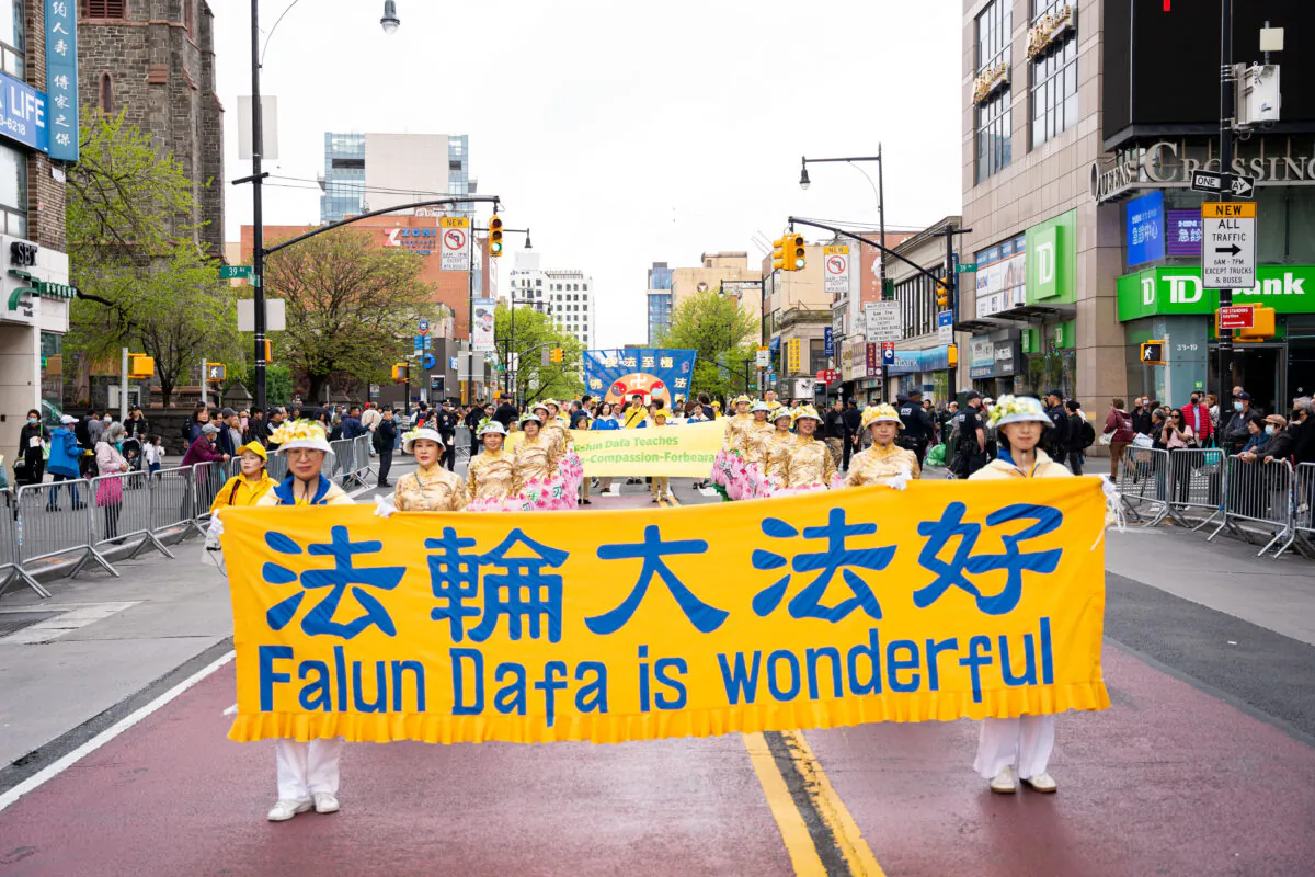 Falun Gong practitioners participate in a parade to call for an end to the Chinese Communist Party's persecution of their faith in the Flushing neighborhood of Queens, N.Y., on April 23, 2023. (Chung I Ho/The Epoch Times)