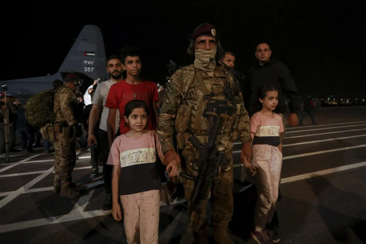 Jordanians evacuated from Sudan arrive at a military airport in Amman, Jordan, on April 24, 2023. (Raad Adayleh/AP Photo)