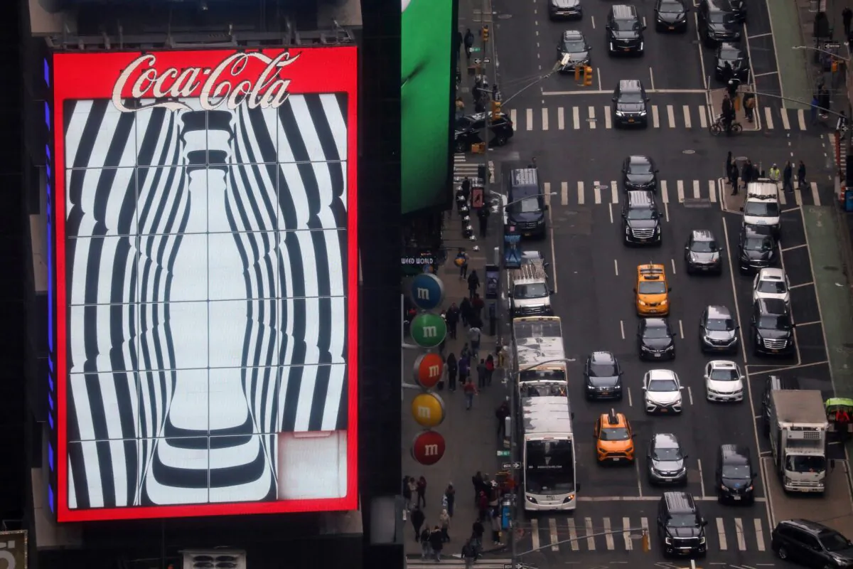 Traffic passes a Coca-Cola digital billboard in the Times Square area of Manhattan in New York on March 2, 2023. (Chris Helgren/Reuters)