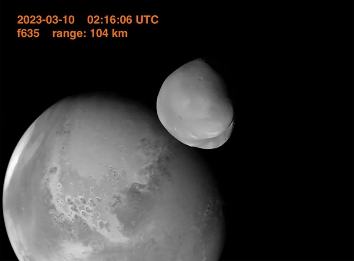 The planet Mars and its moon, Deimos, in the foreground. (UAE Space Agency via AP)
