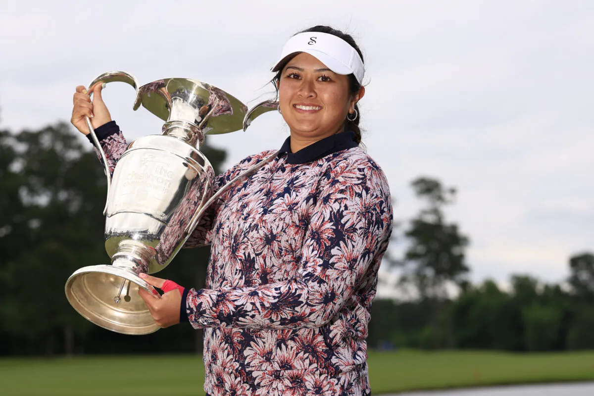 Lilia Vu of the United States celebrates with the trophy after winning in a one-hole playoff during the final round of The Chevron Championship at The Club at Carlton Woods in The Woodlands, Texas, on April 23, 2023. (Carmen Mandato/Getty Images)