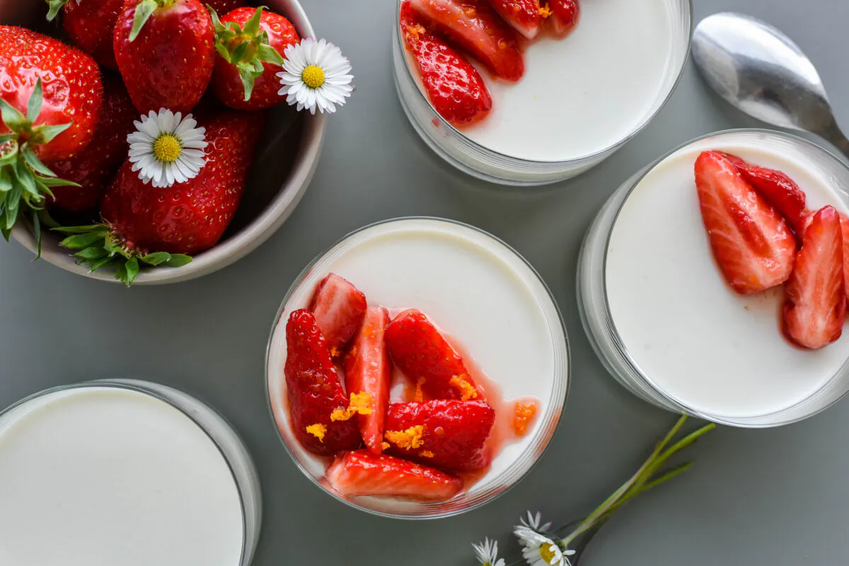 Fresh strawberries, perfumed with orange zest, are a sublime springtime topping for a classic almond milk blanc-manger. (Audrey Le Goff)