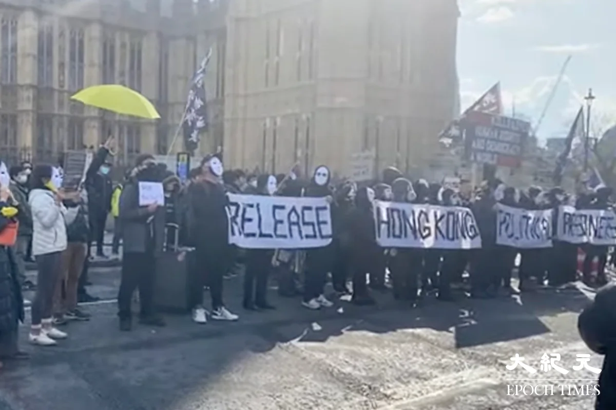 Over a hundred Hongkongers rallied in Parliament Square in support of the defendants in the Hong Kong primary election case, in London, on April 23. (Audrey Lee/The Epoch Times/UK)