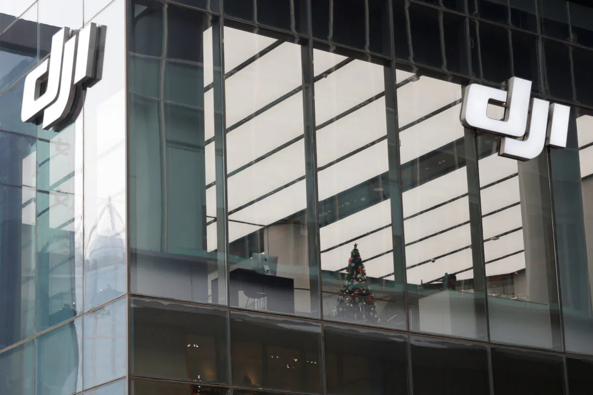Logos of Chinese drone maker DJI on the facade of its store in Beijing on Dec. 15, 2021. (Carlos Garcia Rawlins/Reuters)
