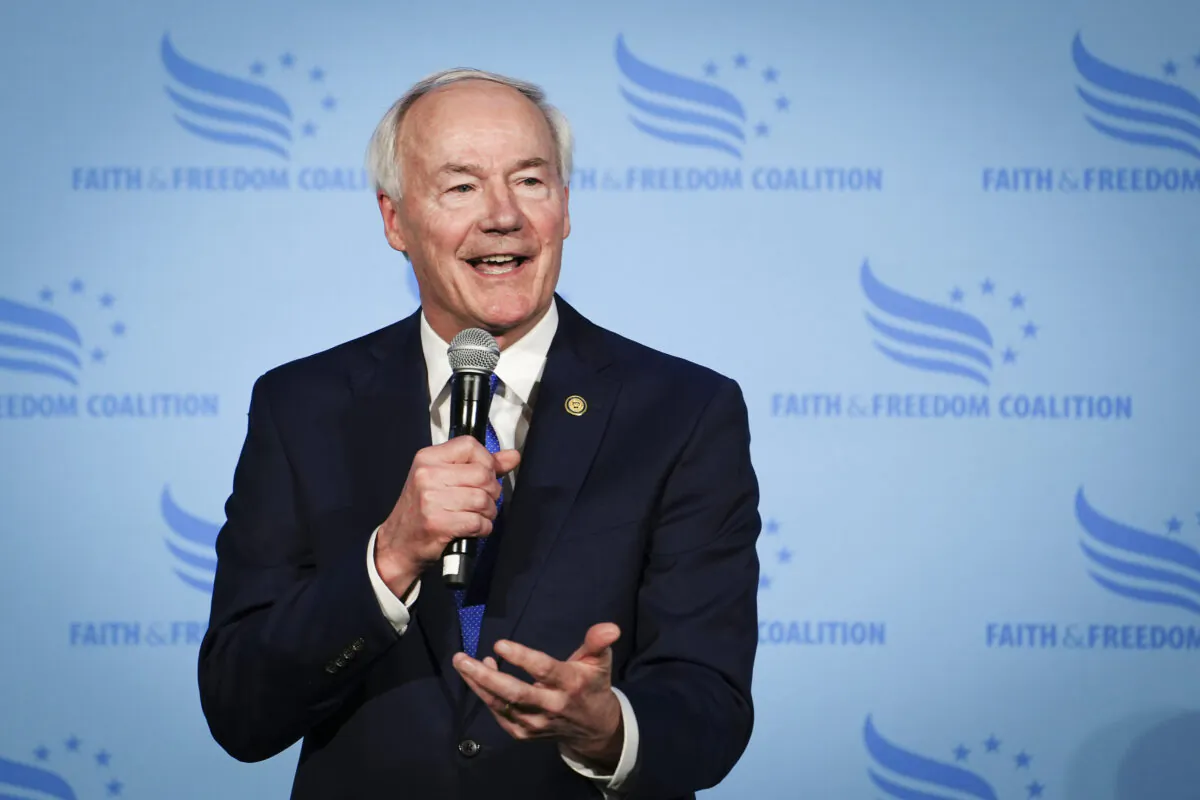 Arkansas Governor Asa Hutchinson speaks at the Iowa Faith & Freedom Coalition stage backdrop in Clive, Iowa, on April 22, 2023. (Madalina Vasiliu/The Epoch Times)