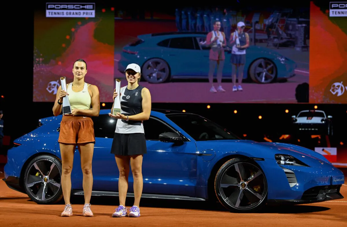 Winner Poland's Iga Swiatek (R) and Belarus' Aryna Sabalenka pose with their trophies after the Women's Tennis Grand Prix WTA tournament final match in Stuttgart, Germany, on April 23, 2023. (Thomas Kienzle/AFP via Getty Images)