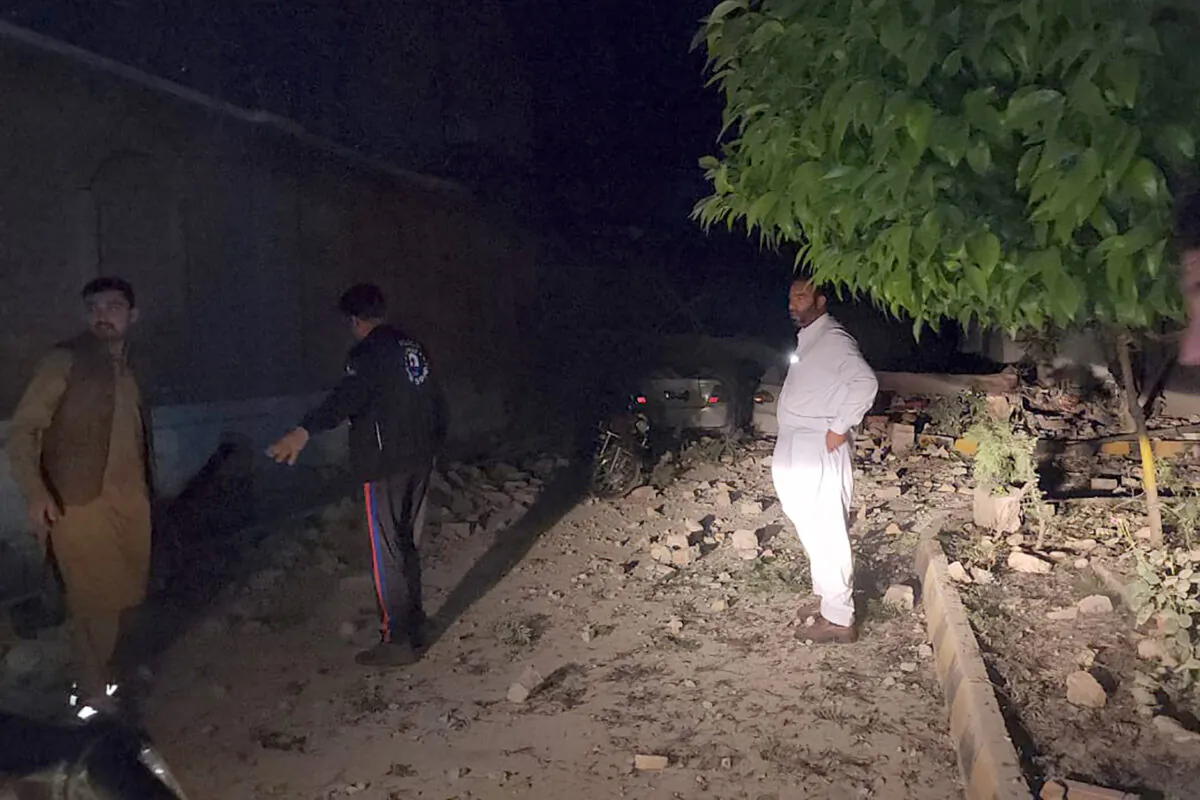 Plainclothes police officers gather at the site of a bomb explosion, in Kabal, an area of Pakistan's Swat Valley on April 24, 2023. (Sherin Zara/AP Photo)