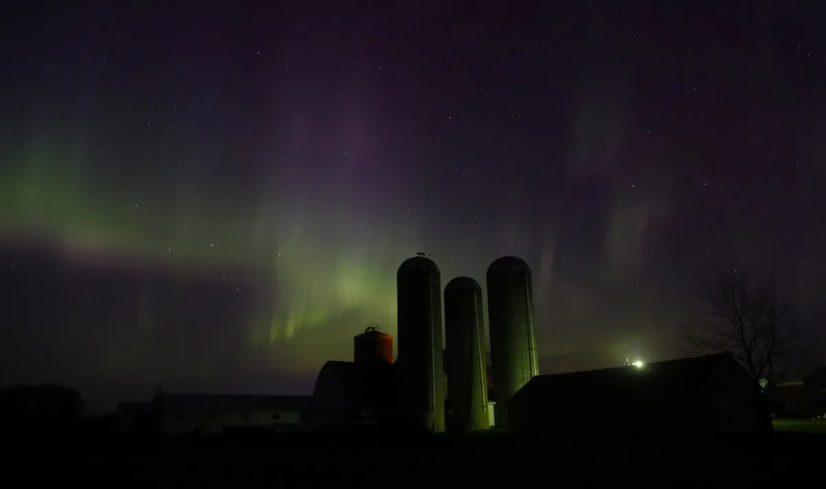 The northern lights are seen over a farm near Pulaski, Wis., on April 23, 2023. (Sarah Kloepping/The Post-Crescent via AP)