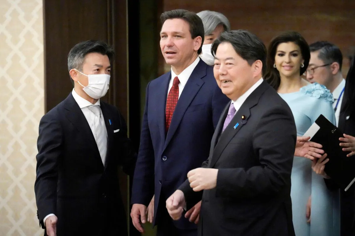 Florida Governor Ron DeSantis (C) and Japanese Foreign Minister Yoshimasa Hayashi (R) are escorted to the venue of their meeting at the Iikura Guest House in Tokyo on April 24, 2023. (EUGENE HOSHIKO/POOL/AFP via Getty Images)
