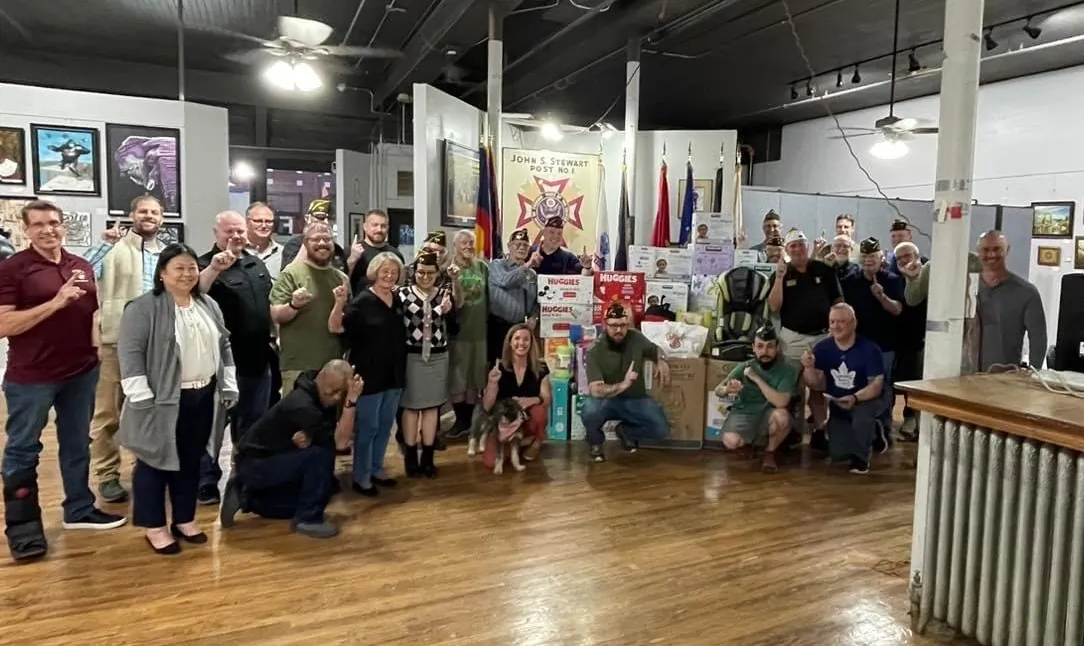 Members of John S. Stewart VFW Post 1 and members of the community pose with baby gear they collected in a drive for the Colorado-based nonprofit WeeCycle. (Courtesy of John S. Stewart VFW Post 1)