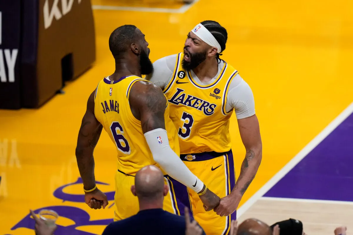 Los Angeles Lakers' LeBron James (6) and Anthony Davis (3) celebrate a basket by James in overtime in Game 4 of a first-round NBA basketball playoff series against the Memphis Grizzlies on April 24, 2023, in Los Angeles. (Jae C. Hong/AP Photo)