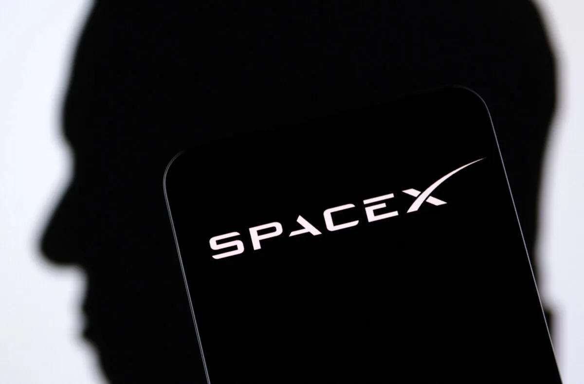 SpaceX logo and Elon Musk silhouette in an illustration taken on Dec. 19, 2022. (Dado Ruvic/Illustration/Reuters)