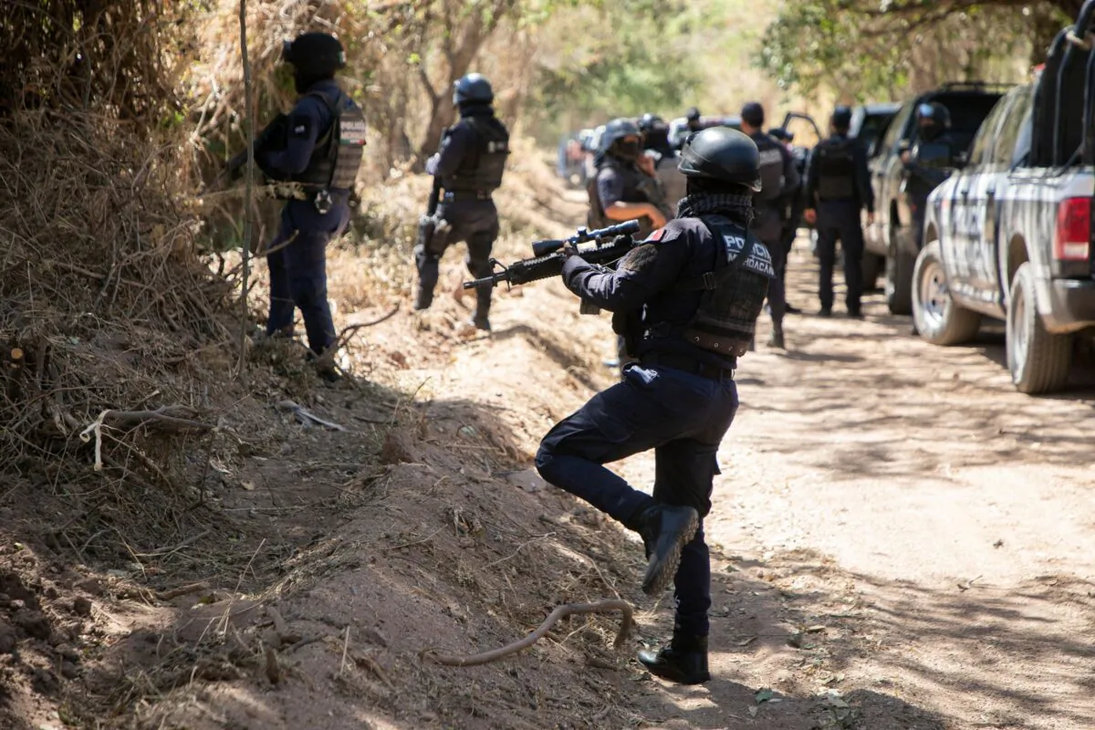 Police remain at the site where the body of Rene Cervantes, advisor to Mayor Cesar Arturo Valencia, was found, in Aguililla, Michoacan state, Mexico, on March 11, 2022. (Enrique Castro/AFP via Getty Images)
