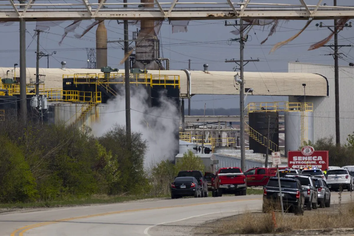 Emergency crews respond to an explosion at the Seneca Petroleum Company in Lemont, Ill., on April 25, 2023. (Eileen T. Meslar/Chicago Tribune via AP)