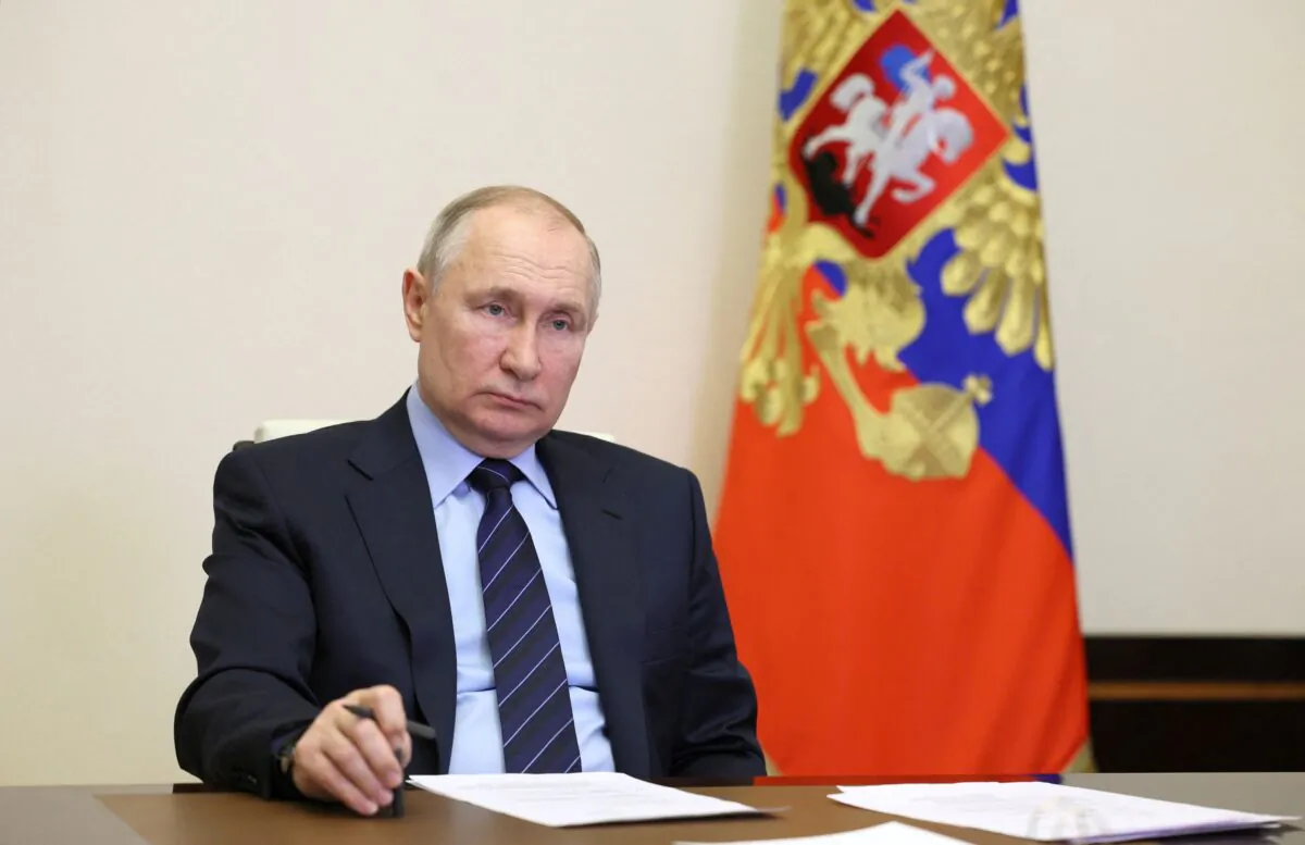 Russian President Vladimir Putin chairs a meeting of the Presidential Council for the Local Self-Government Development via a video link at the Novo-Ogaryovo state residence outside Moscow on April 20, 2023. (Sputnik/Gavriil Grigorov/Kremlin via Reuters)