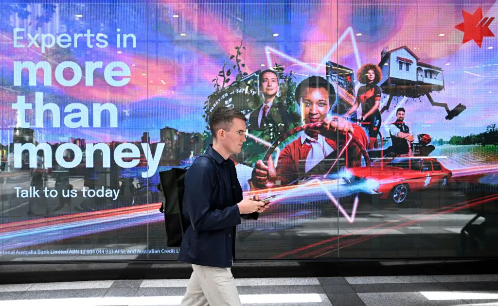 A man walks past a bank in Melbourne, Australia on Feb. 7, 2023. (William West/AFP via Getty Images)