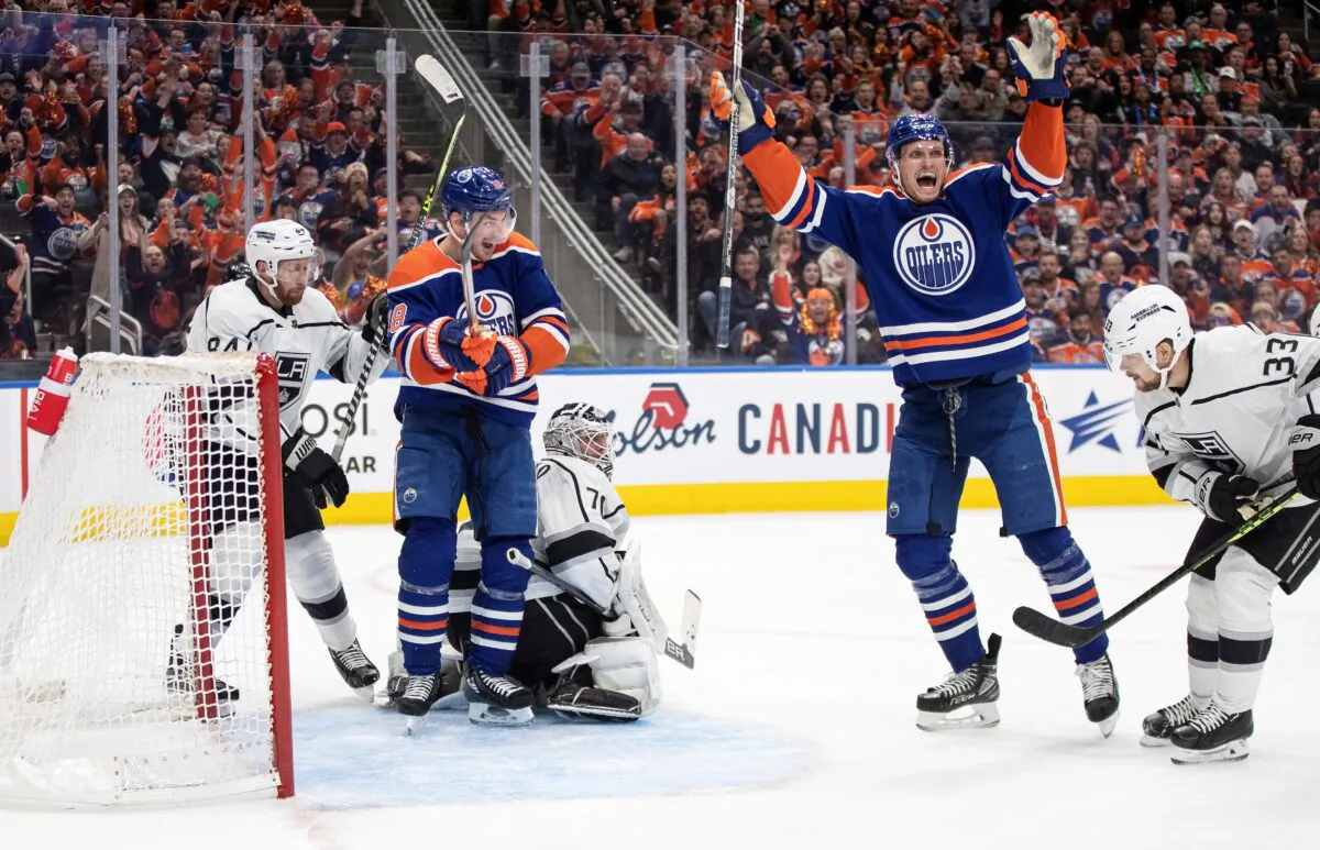 Los Angeles Kings' goalie Joonas Korpisalo (70) Edmonton Oilers' Nick Bjugstad (72) and Zach Hyman (18) celebrate a Kings goal on Los Angeles Kings goalie Joonas Korpisalo during the second period of Game 5 of an NHL hockey Stanley Cup first-round playoff series in Edmonton, Alberta, Canada, on April 25, 2023. (Jason Franson/The Canadian Press via AP)