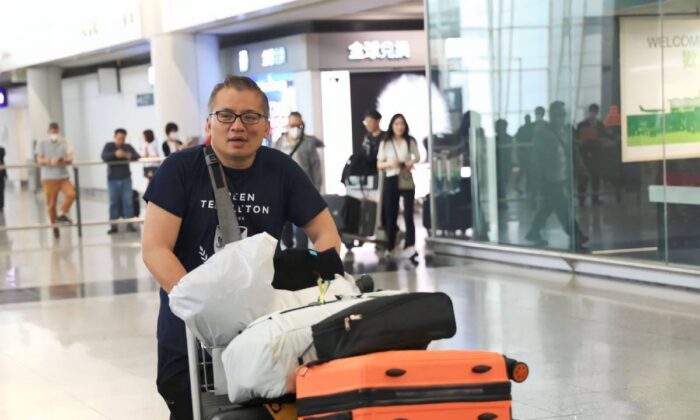 Hong Kong Journalist Association President Chan Ron-sing arrived at the International Hong Kong Airport Arrival Hall on April 23, 2023. (Zheng Zhaodong/The Epoch Times)