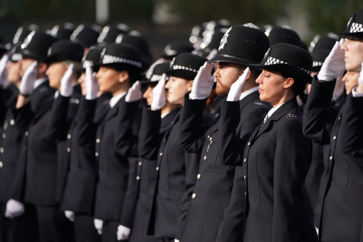 New recruits salute during a passing-out parade at Hendon Police Academy in north west London, England, on Oct. 27, 2022. (PA)