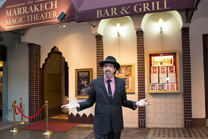Jay Alexander in front of the theater and restaurant that houses his show. (Courtesy of Marrakech Magic Theater)