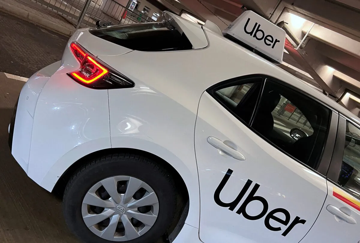 Uber branding is seen on private hire vehicle at Chopin Airport in Warsaw, Poland, on March 22, 2023. (Toby Melville/Reuters)