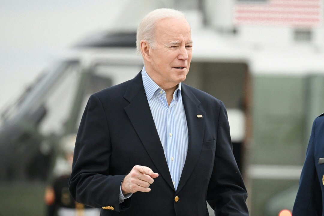 US President Joe Biden makes his way to board Air Force One before departing from Joint Base Andrews in Maryland on March 31, 2023. - Biden is heading to Rolling Fork, Mississippi to survey storm damage. (Photo by Mandel NGAN / AFP) (Photo by MANDEL NGAN/AFP via Getty Images)