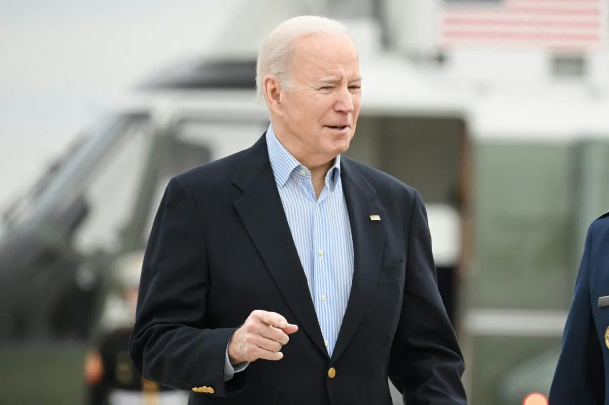 US President Joe Biden makes his way to board Air Force One before departing from Joint Base Andrews in Maryland on March 31, 2023. - Biden is heading to Rolling Fork, Mississippi to survey storm damage. (Photo by Mandel NGAN / AFP) (Photo by MANDEL NGAN/AFP via Getty Images)