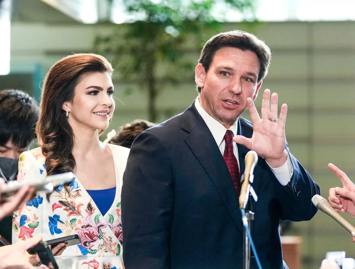 Florida Governor Ron DeSantis (R) waves to journalists as his wife Casey (L) looks one after meeting Japanese Prime Minister Fumio Kishida at the latter's official residence in Tokyo on April 24, 2023. (Photo by Kimimasa MAYAMA / POOL / AFP) (Photo by KIMIMASA MAYAMA/POOL/AFP via Getty Images)